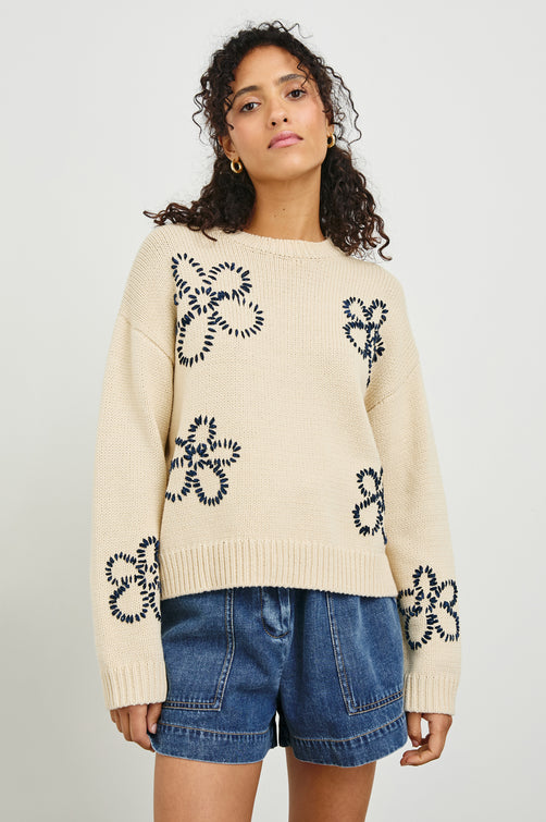 ZOEY-IVORY-NAVY-STITCHED-DAISIES-FRONT